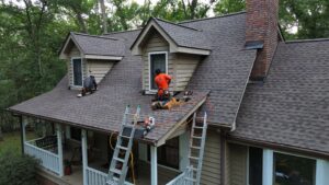 shingle roof replacement with team on ladders by Skyline Contracting in Gainesville, GA