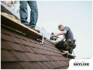 workmen on roof logo