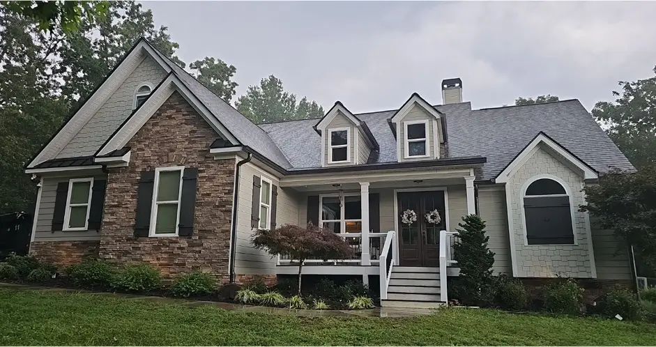 Finished roof and new siding on a single-story residential home, result of the roof repair process by Skyline Contracting