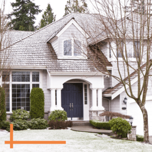 multi level residential home exterior covered in snow