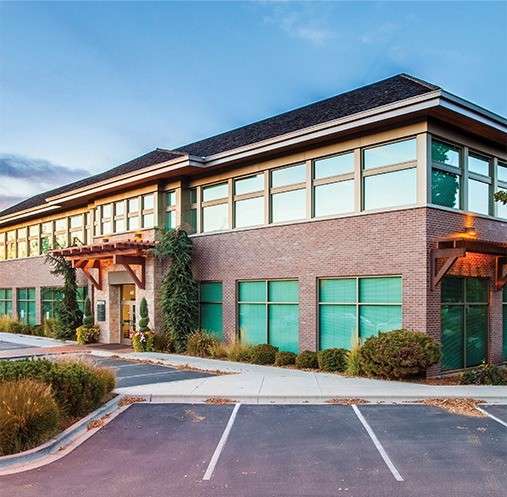 commercial building with brick and exterior windows