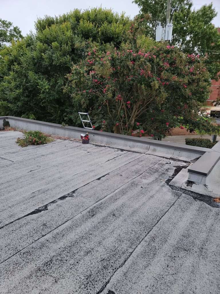 commercial roof maintenance being performed by a roofing contractor with skyline contracting