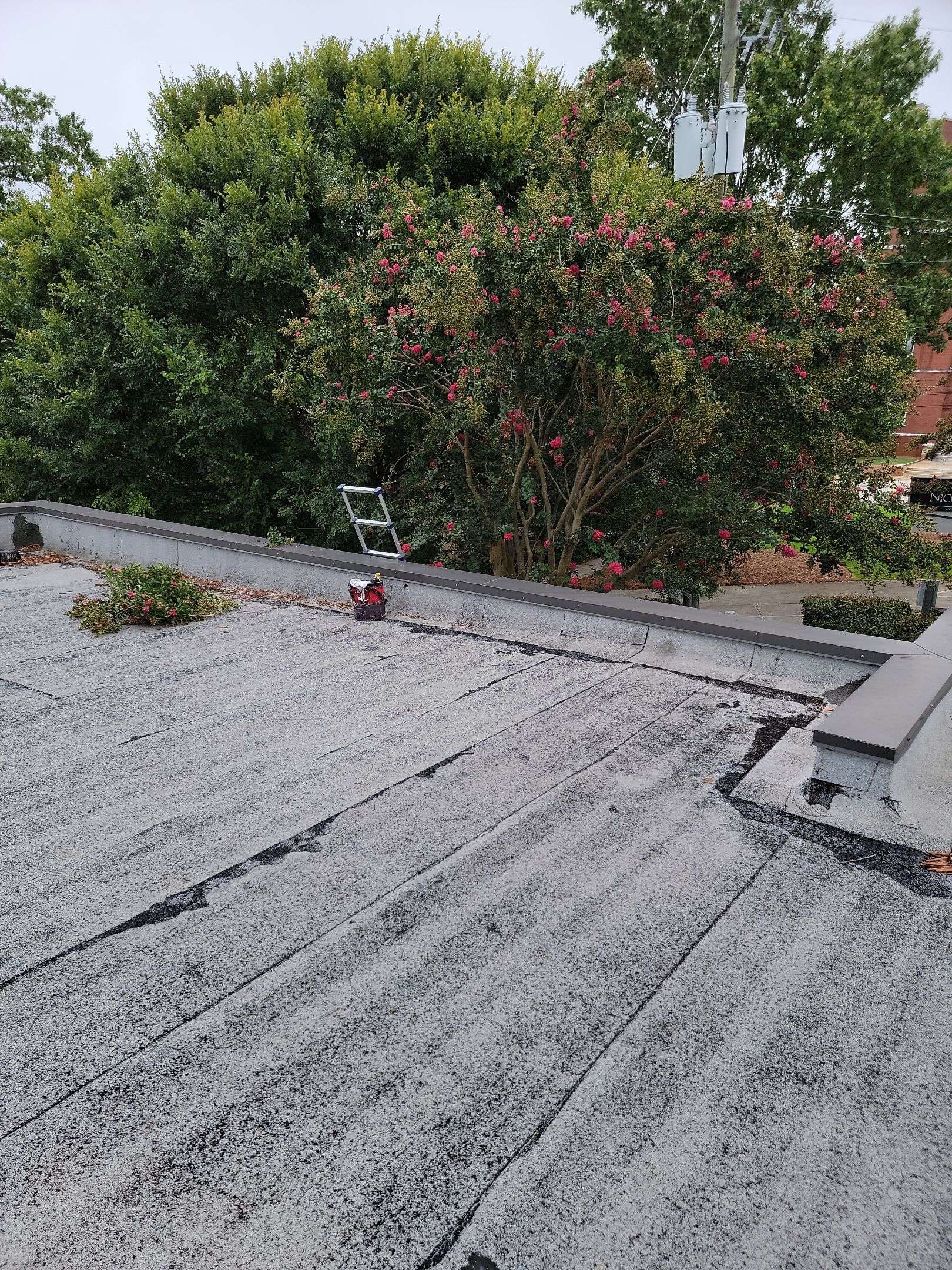 commercial roof maintenance being performed by a roofing contractor with skyline contracting