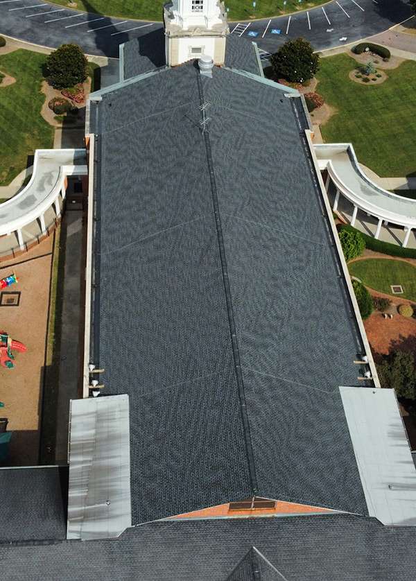 Church roofing from the top view with grey shingles