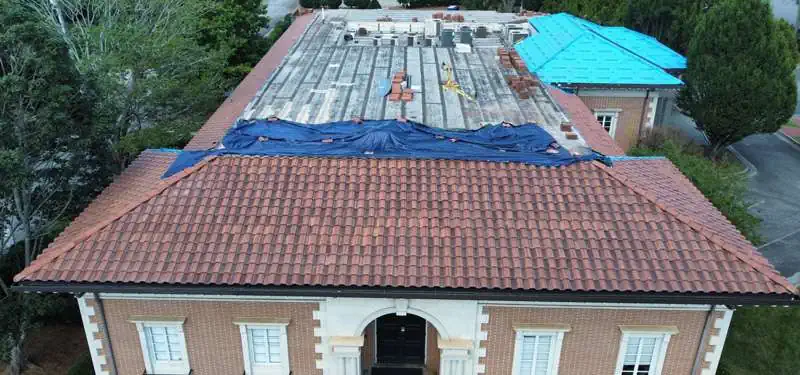arial view of a commercial roof replacement with red tile roof