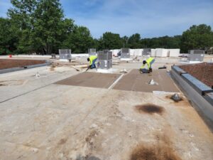 a commercial roofing team replaces a roof in Gainesville, GA