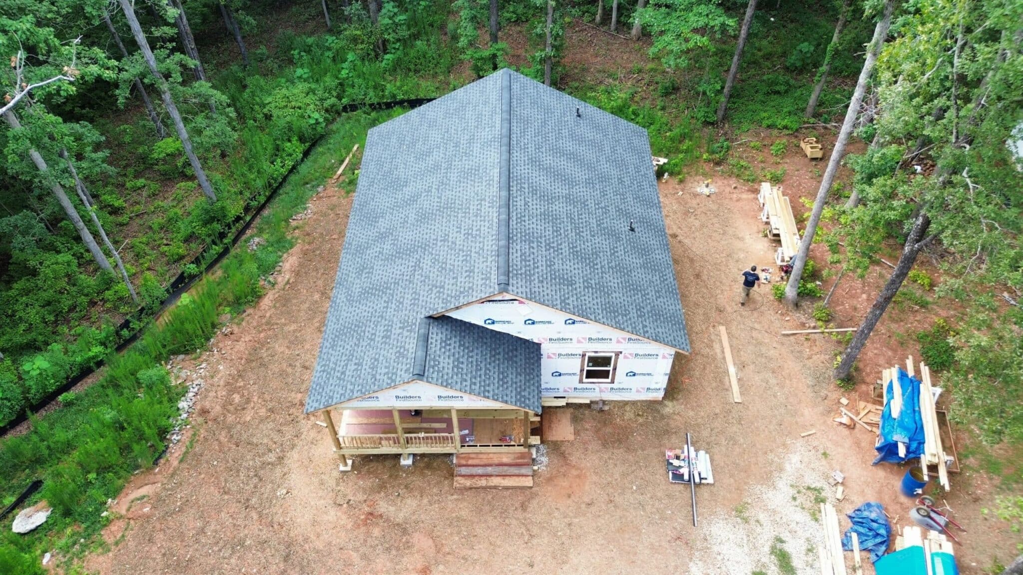 Aerial view of a house with a new roof under construction in Gainesville, GA