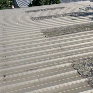 A white metal roof that has molds and is needing a roof maintenance by certified roofing specialists in Gainesville, GA