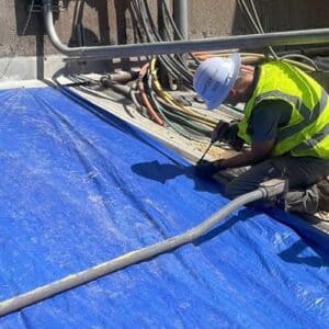 A certified roofing specialists in a process of commercial roof repair in Gainesville, GA