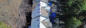 A multi-unit residential building undergoing roof replacement with Skyline Contracting roofing contractors in Gainesville, GA