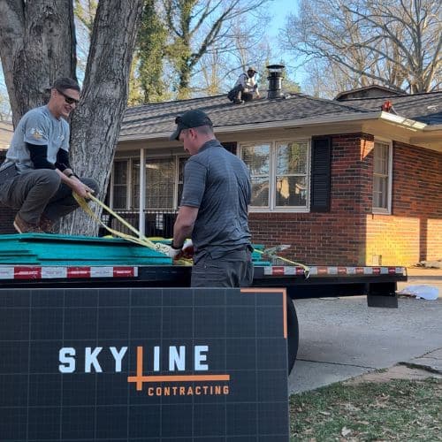 Skyline Contracting team members unloading roofing materials for a roof replacement in Gainesville, GA