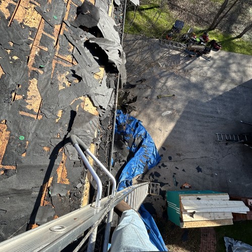 Gainesville home before roof replacement showing worn and damaged shingles