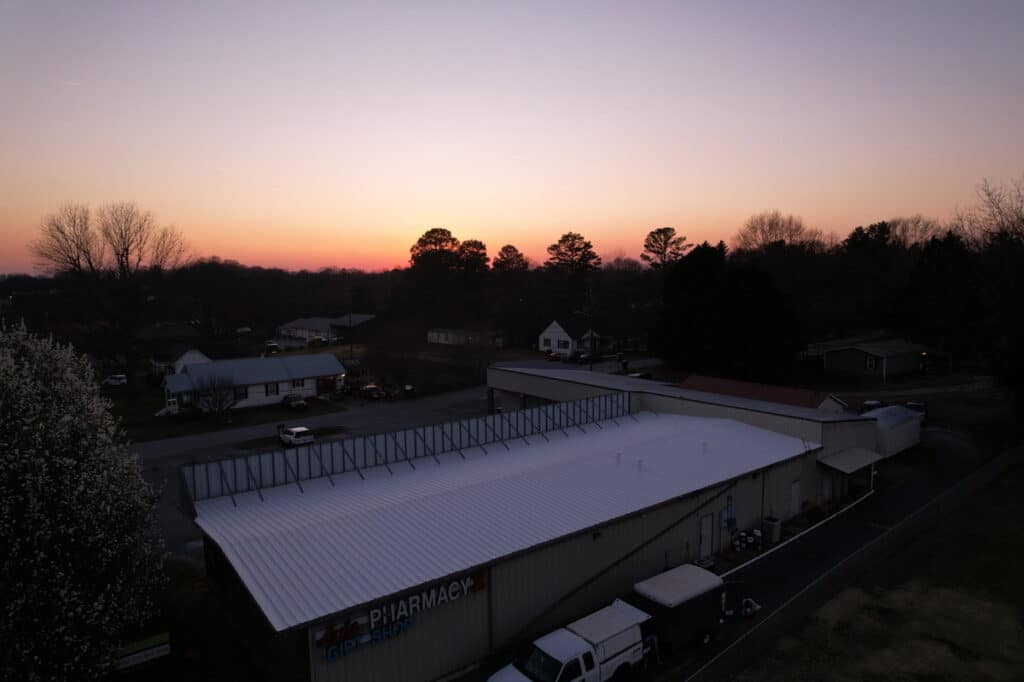 Completed commercial roof with sleek and weather-resistant finish
