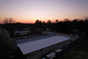 Completed commercial roof with sleek and weather-resistant finish