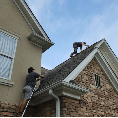 Skyline Contracting team working on a steep residential roof