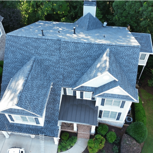 View of a classic steep gable roof under clear sky