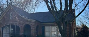 Roofer instalation roofing panels on residential property