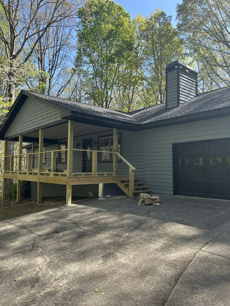 Newly Constructed Front Deck with Stairs and gable roof by Skyline Contracting in Gainesville, GA