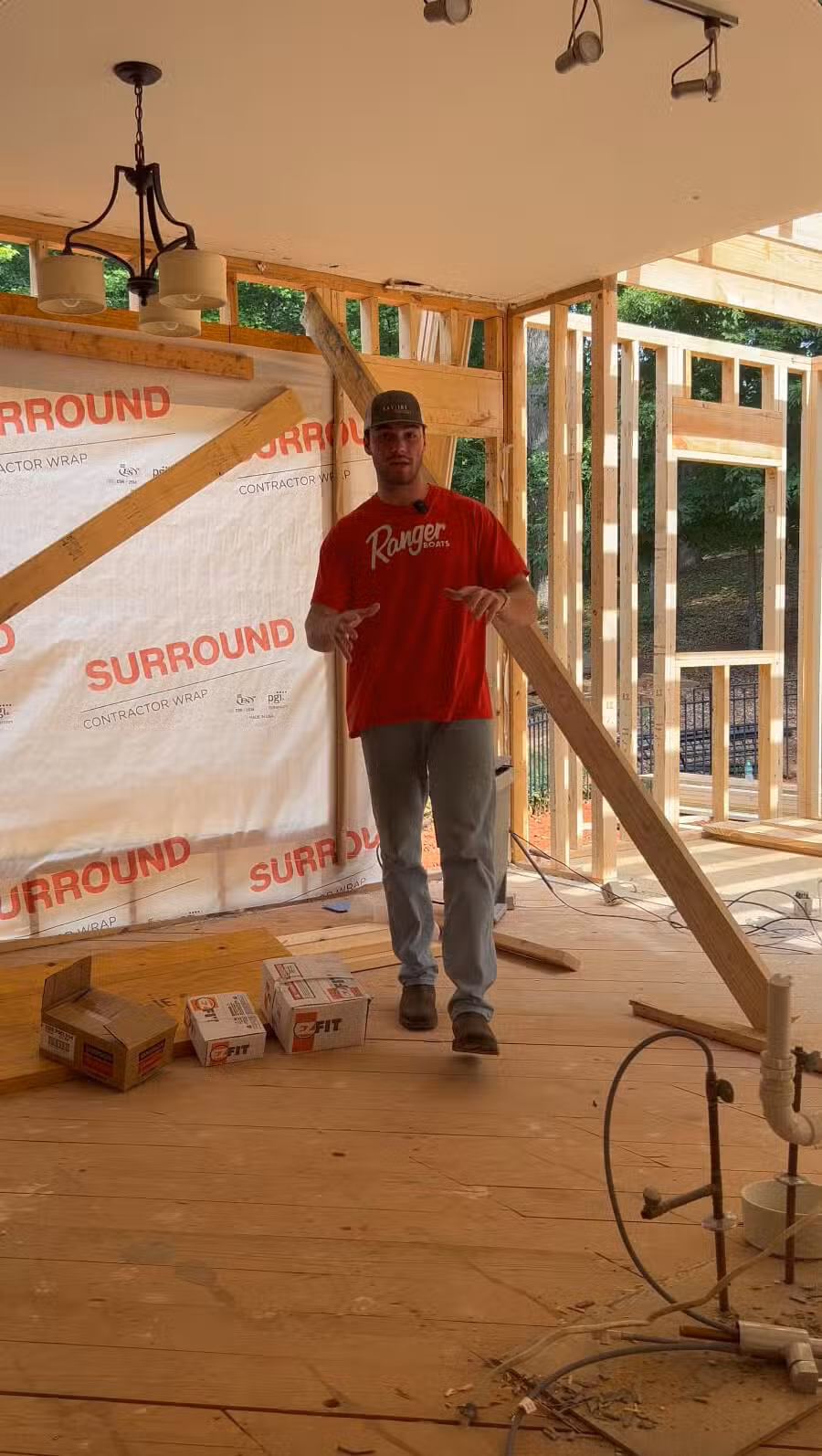 Interior view of a home under renovation by Skyline Contracting in Gainesville, GA, Max showing exposed framing and contractor wrap, highlighting remodeling services.
