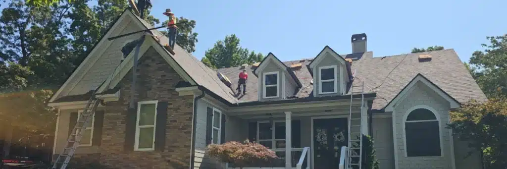 Skyline Contracting crew replacing shingles on a residential roof to improve what is the lifespan of a roof