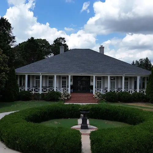 Newly roofed home exterior with landscaping, showcasing results tied to key questions to ask a roofing contractor by Skyline Contracting