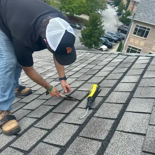 A residential roof with colorful holiday lights, highlighting the importance of a solid roof for which Skyline Contracting offers cost-effective roof repair