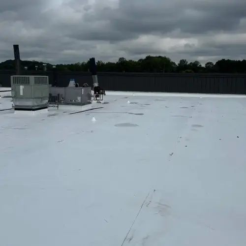 Clean commercial roof surface with HVAC units maintained for optimal performance by Skyline Contracting
