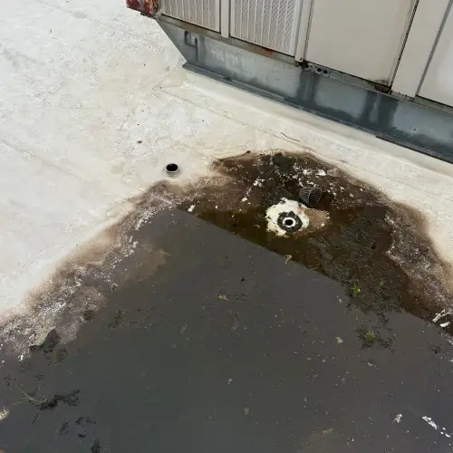 Commercial roof maintenance addressing standing water and drainage problems by Skyline Contracting