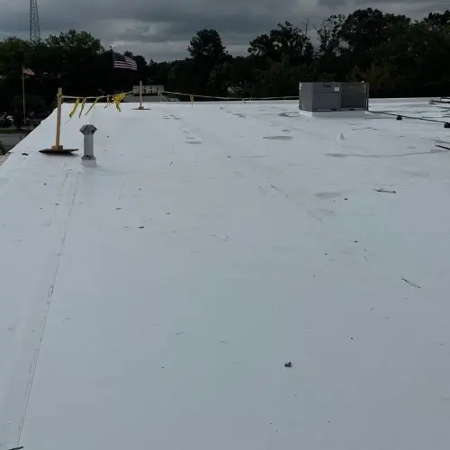 Well-maintained commercial roof with clean TPO membrane and rooftop equipment by Skyline Contracting