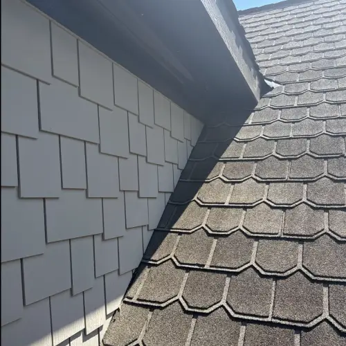 Close-up view of durable slate roofing showcasing detailed shingle design and texture under sunlight by Skyline Contracting