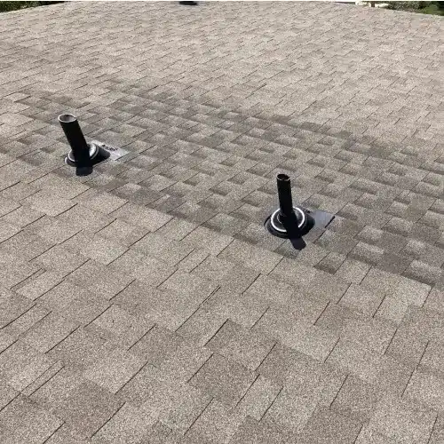 Commercial roofing expert inspecting a large flat roof to optimize return on investment through preventative maintenance by Skyline Contracting