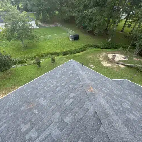 Skyline Contracting specialist inspecting a damaged roof for a roof insurance claim