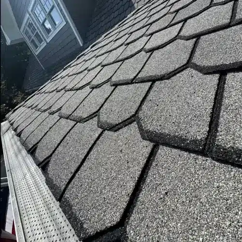 Close-up view of a durable and elegant slate roof installed by Skyline Contracting showcasing the benefits of long-lasting roofing materials.