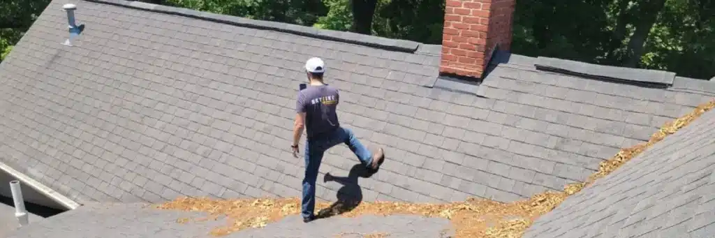 Professional roofer performing wind damage roof inspection by Skyline Contracting in Gainesville