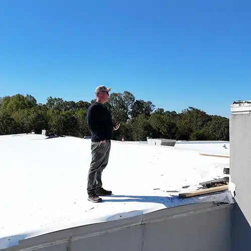 Professional Roof Inspector Following Commercial Roof Inspection Checklist by Skyline Contracting in Gainesville, GA