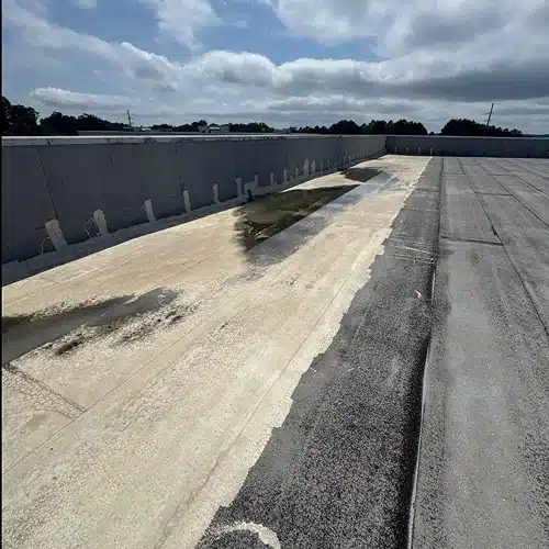 Pooling water and damaged roof section identified during commercial roof inspection by Skyline Contracting in Gainesville, GA