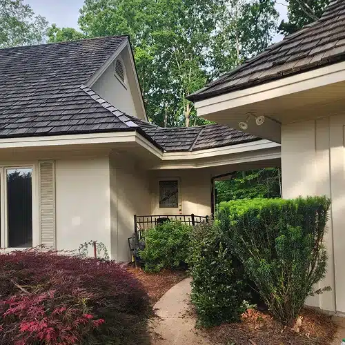Clean and well-maintained wood shake roof surrounded by landscaping by Skyline Contracting in GA