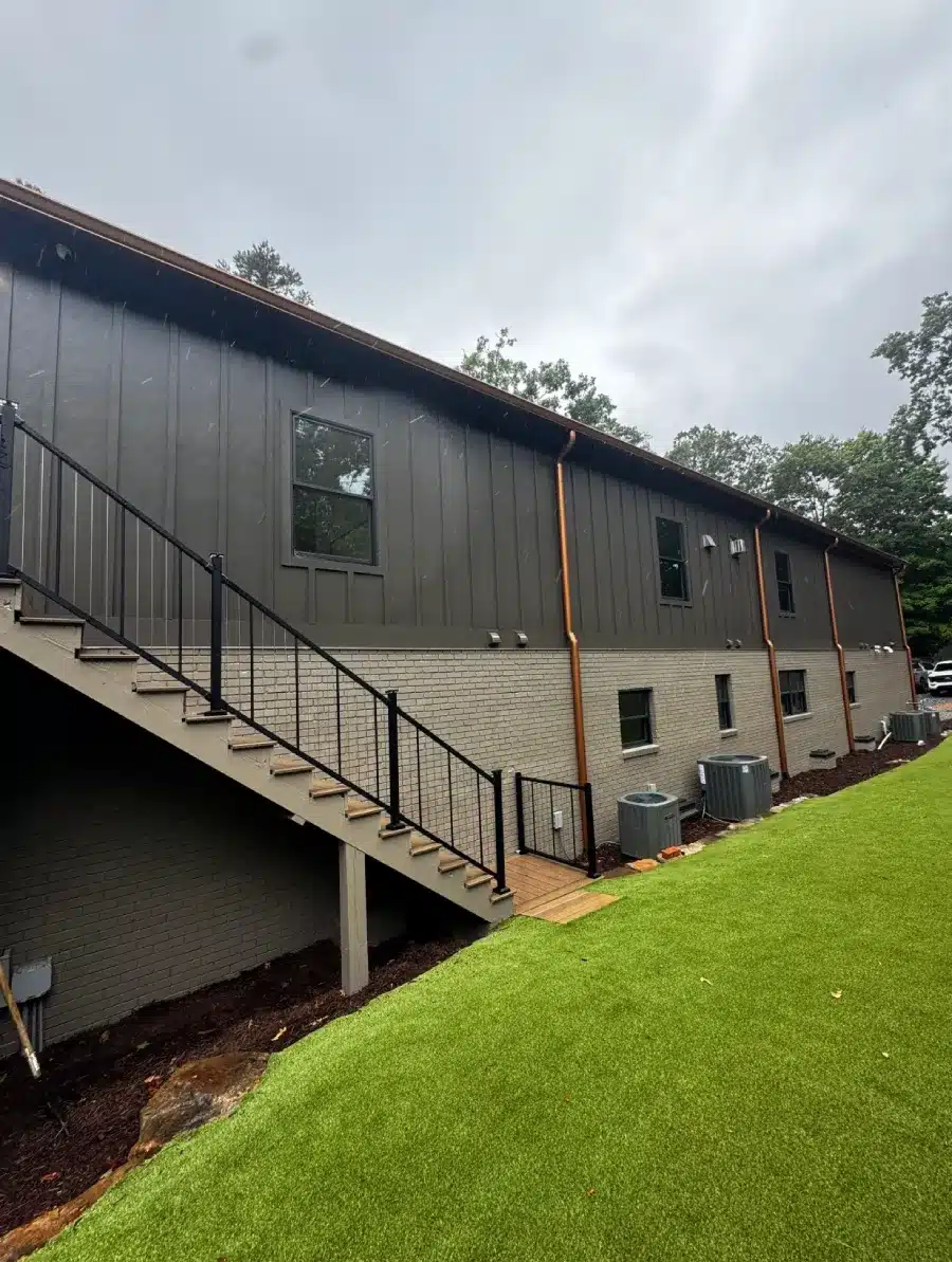 Updated commercial building exterior with new stairs, brick siding, and efficient HVAC layout by Skyline Contracting in Gainesville, GA