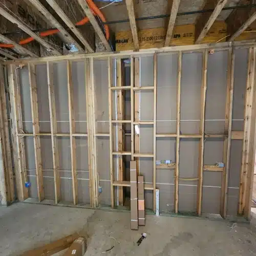 Exposed wall studs and electrical wiring illustrating indoor preparation before roofing work what to expect during a roof replacement by Skyline Contracting in Gainesville