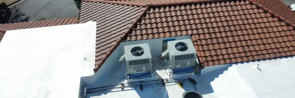 CertainTeed roofing products roof detail with tile section and flat roof by HVAC units by Skyline Contracting in Gainesville
