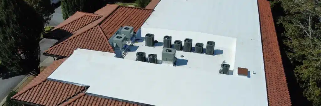 Commercial roofing inspection with rooftop HVAC units and flat membrane roof by Skyline Contracting in Gainesville