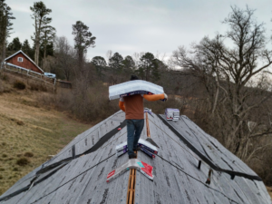Skyline Contracting crew on top of an ongoing roof replacement project in Gainesville, GA