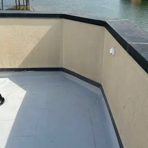 A wide view of a residential flat roof replacement project showcasing modern design by Skyline Contracting | Roofing Contractor & Remodeler in GA